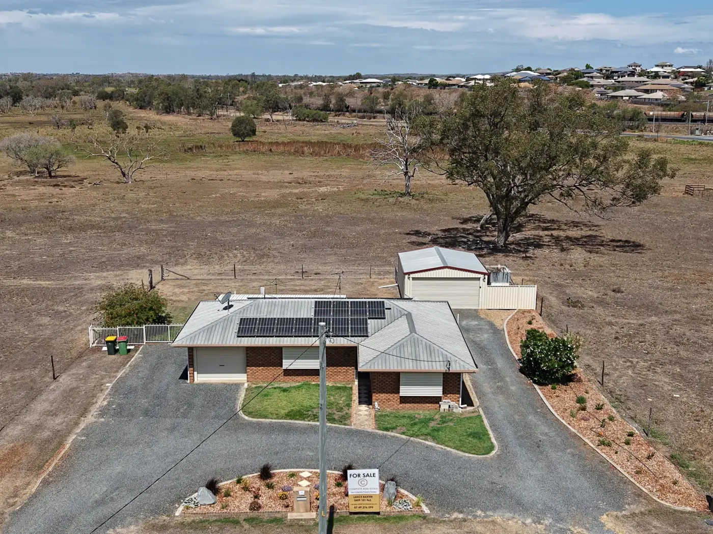Aerial of 72 Old Capricorn Highway, Gracemere, with the circular driveway and open outlook