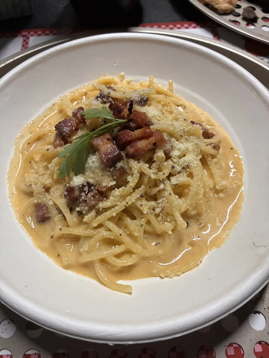 Fresh fettuccine carbonara with crispy pancetta and cheese